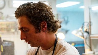 Jeremy Allen White as Chef Carmy in the kitchen in The Bear