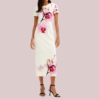 flat lay image of woman wearing white and pink floral dress