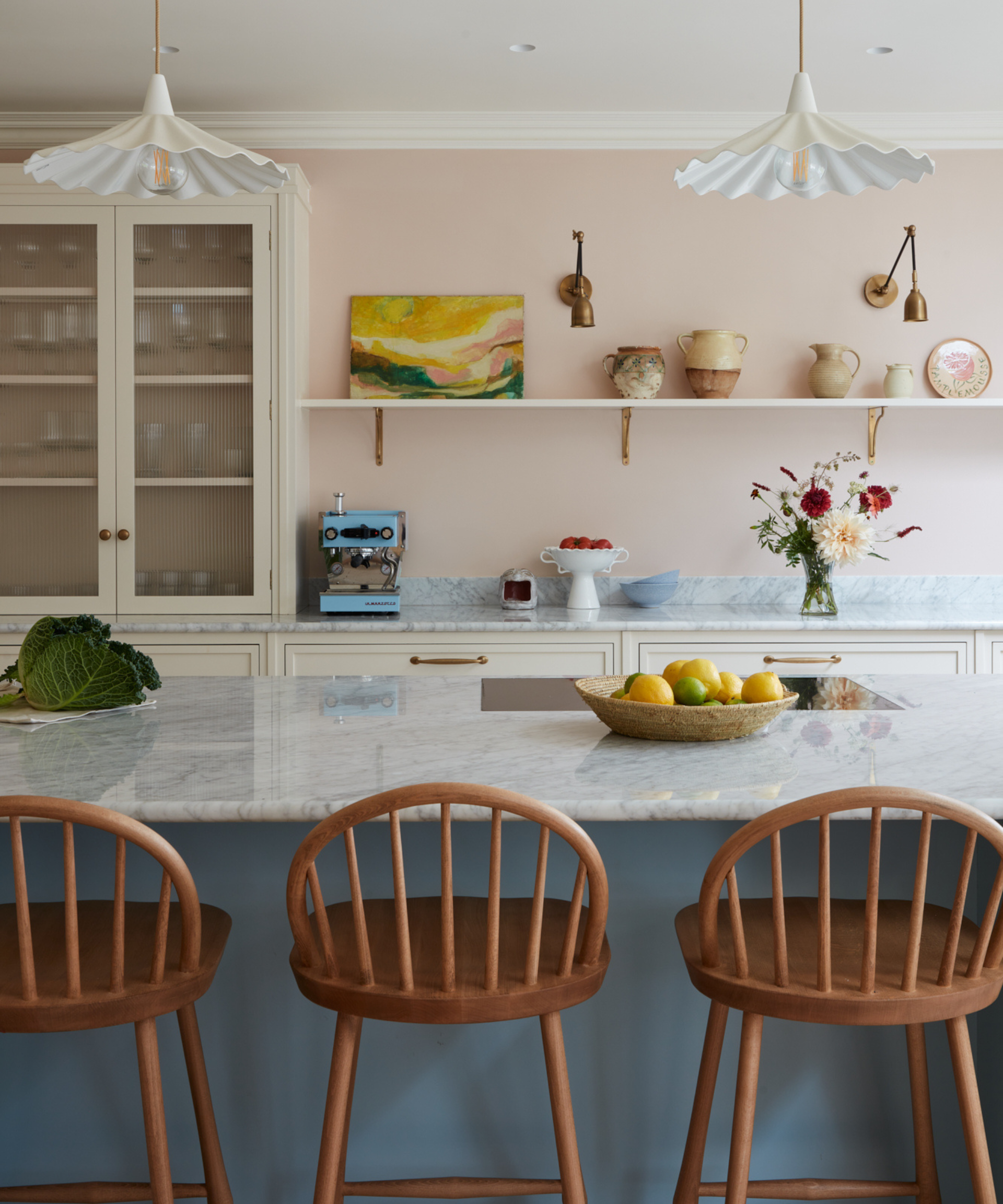 modern kitchen with pink walls and marble counter top