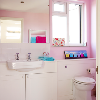bathroom with pink and white colour