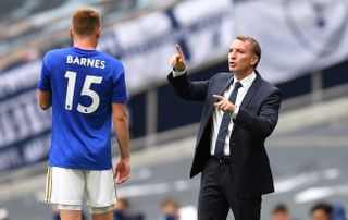 Leicester City manager Brendan Rodgers (right) speaks with Harvey Barnes on the touchline during the Premier League match at the Tottenham Hotspur Stadium, London