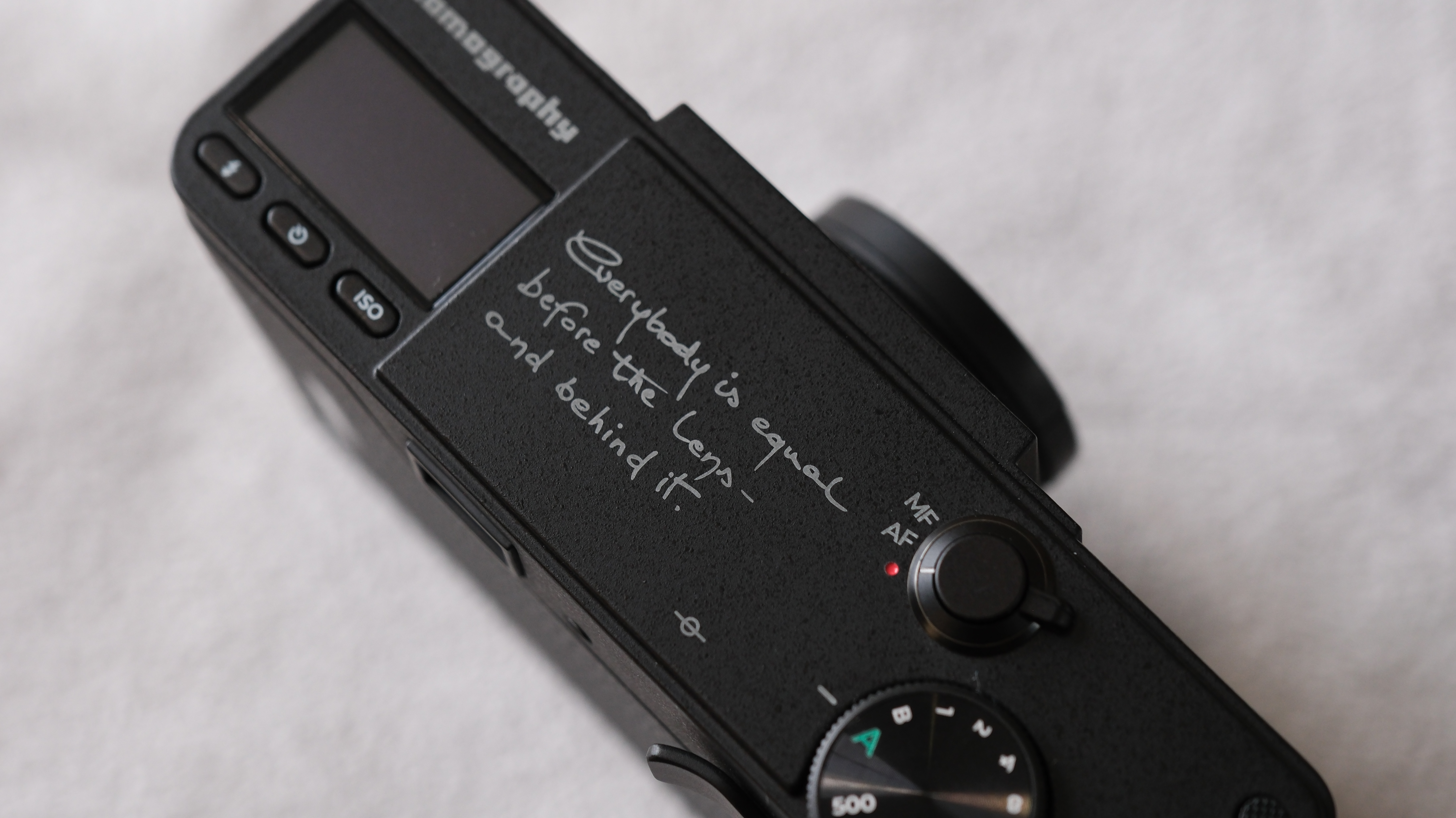 Close up of text printed on the top of a Lomography Lomo MC-A camera