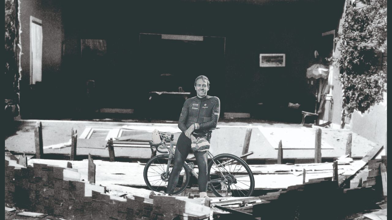 Dowsett stands in ruins of a home