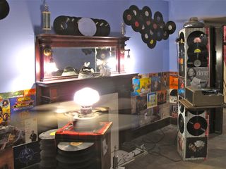 Old vinyl records, trophies, and furniture
