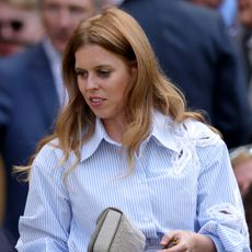 Princess Beatrice wearing a blue striped shirt
