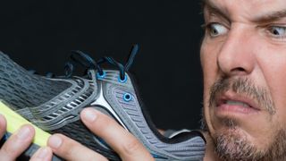 Man disgusted by smell of running shoe