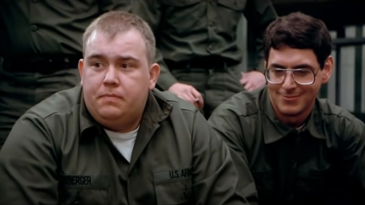 John Candy sitting next to Harold Ramis during introductions in Stripes.