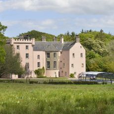 three story villa with cream colour and wall white windows