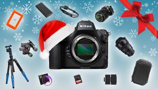 Various photography items on a coloured background with cameras and video accessories for christmas gift guide
