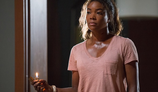 Breaking In Gabrielle Union Shaun holding a threatening lighter
