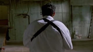 Michael Madsen's back in a white shirt in Reservoir Dogs