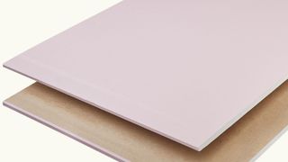 Pink fire resistant plasterboard at an angle