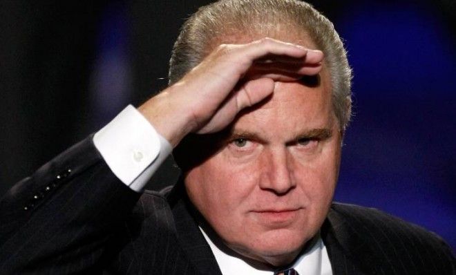 Rush Limbaugh salutes as he is introduced as a judge before a preliminary competition for the 2010 Miss America Pageant in Las Vegas.