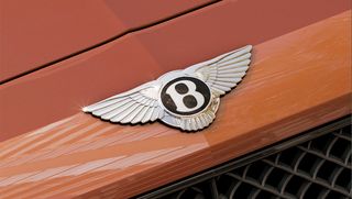 Close up of Bentley logo on front of car