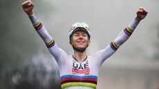 Tadej Pogacar celebrates winning in the rainbow jersey 