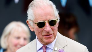 King Charles sunglasses - Queen Camilla's go-to green floral shirt dress