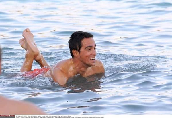 Alberto Contador takes a dip in the sea. Look how happy he is