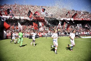 Newell's fans wave flags and cheer on their team ahead of a game against San Lorenzo in October 2016.