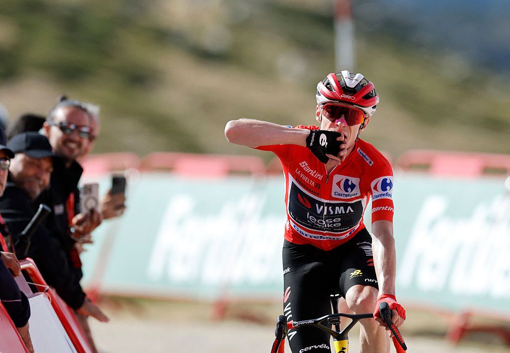 Overall leader team Visma-Lease a bike's Danish rider Jonas Vingegaard celebrates winning the 20th stage of the Vuelta a Espana 2025, a 156 km race between Robledo de Chavela and Bola del Mundo, near Navacerrada, on September 13, 2025. (Photo by Oscar DEL POZO / AFP)