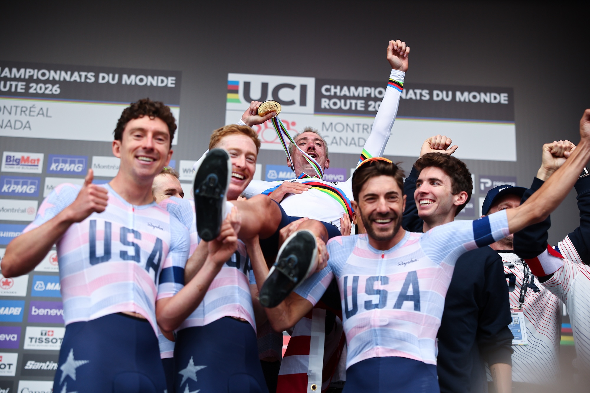 Brandon Mcnulty (USA) celebrates winning to become World Champion with teammates on the podium