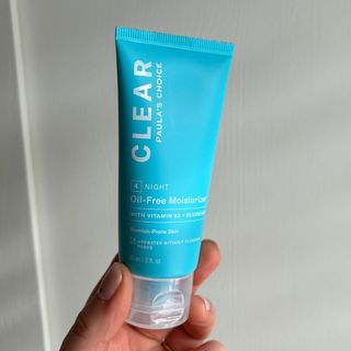Laura holding Paula's Choice Clear Oil-Free Moisturiser - best moisturiser for oily skin