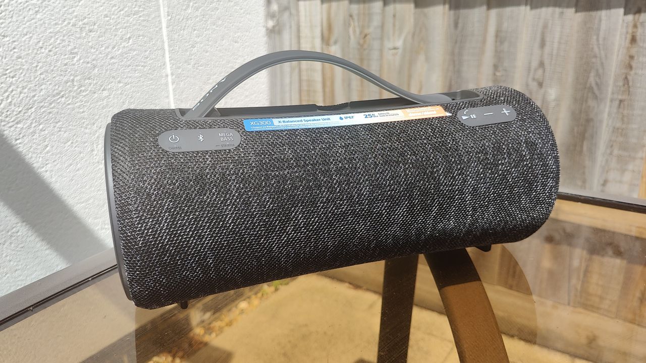 Sony SRS-XG300 review: boombox style speaker on a garden table