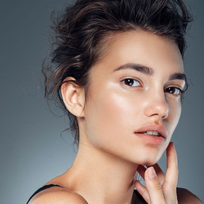 image of a woman with beautifully glowy skin - Best Skin Tints