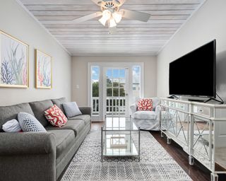 beadboard grey ceilings with grey sofa and glass coffee table