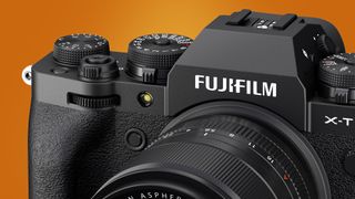 The front of the Fujifilm X-T4 camera on an orange background
