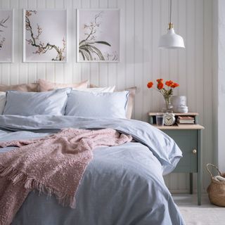 Blue bedding in a neutral room
