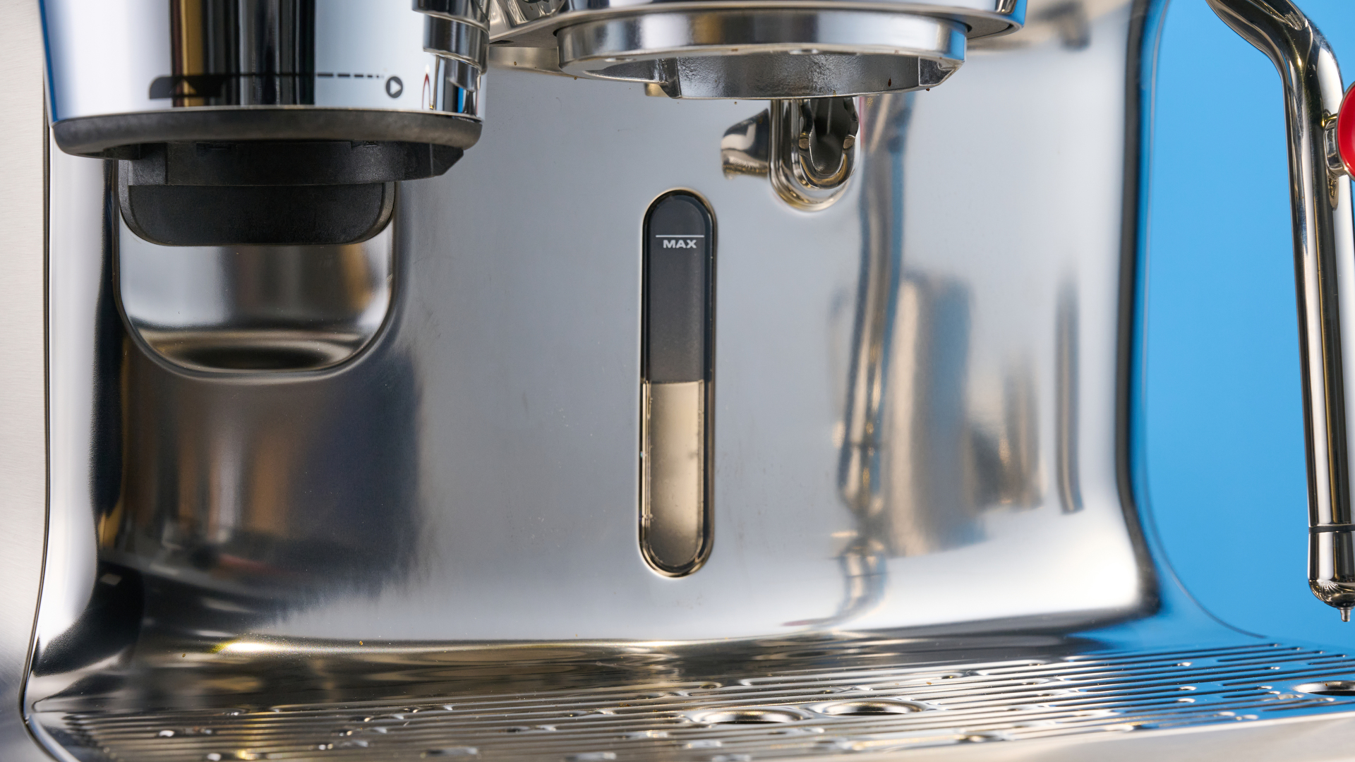 the breville oracle dual boiler / sage oracle dual boiler in stainless steel, showing its touchscreen, steam wand, built in grinder, and espresso shots