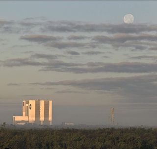The Full Wolf Moon rises behind NASA's Vehicle Assembly Building at the Kennedy Space Center in Florida, in this photo by NASA photographer Ben Smegelsky. To the right of the Vehicle Assembly Building is the mobile launcher that NASA will use to launch its new Space Launch System rocket and Orion crew spacecraft, which the agency plans to use to send astronauts back to the moon in 2024.