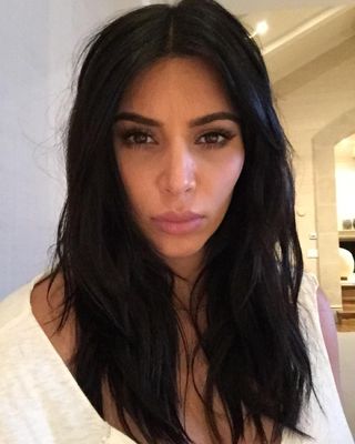 Kim Kardashian with messy hair.