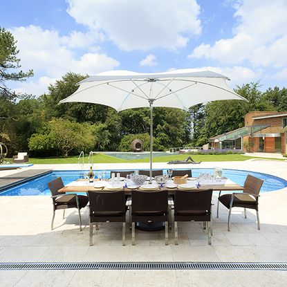 swimming pool next to dining table