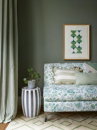 floral green chair with sage green wall