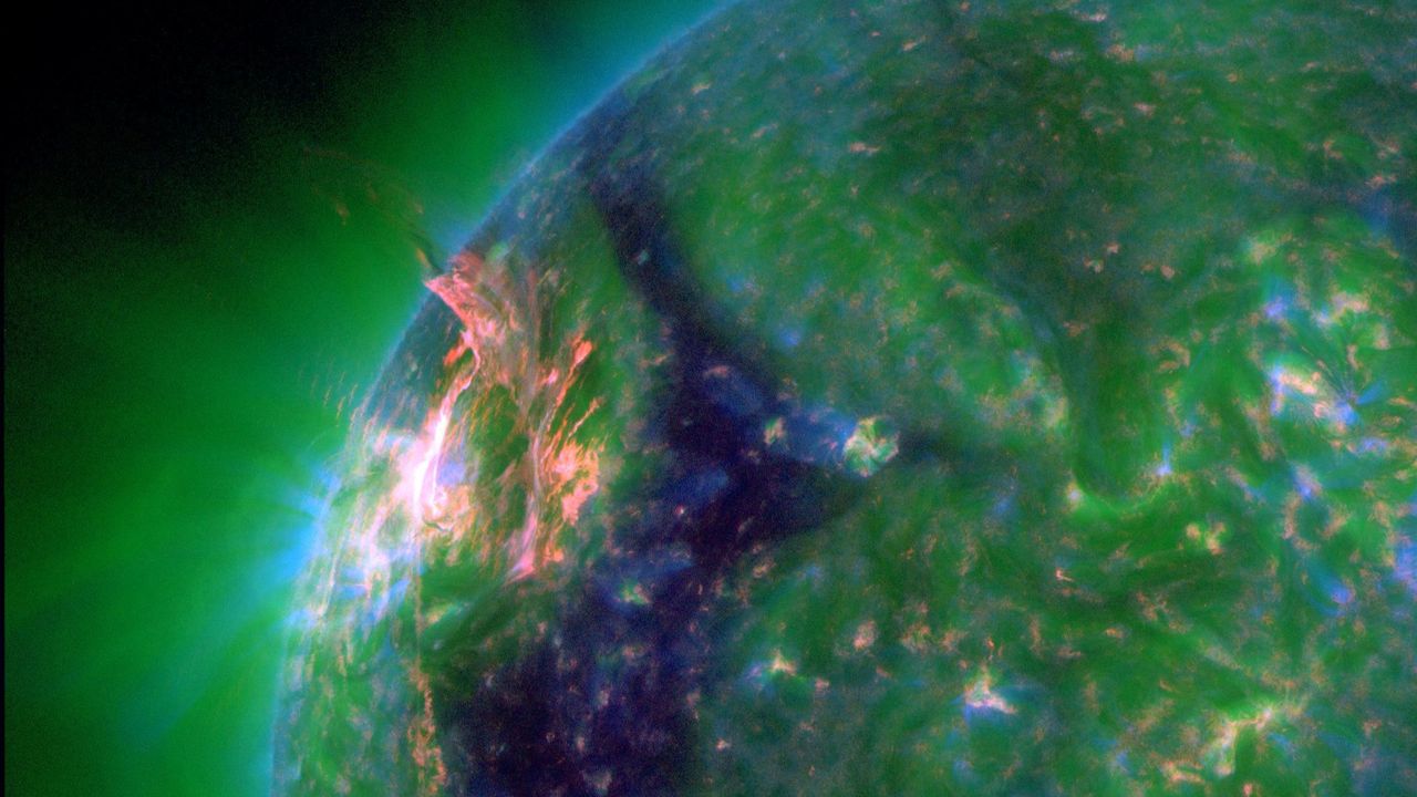  Eruption blows hole in suns atmosphere, unleashing solar flare and potentially triggering northern lights 