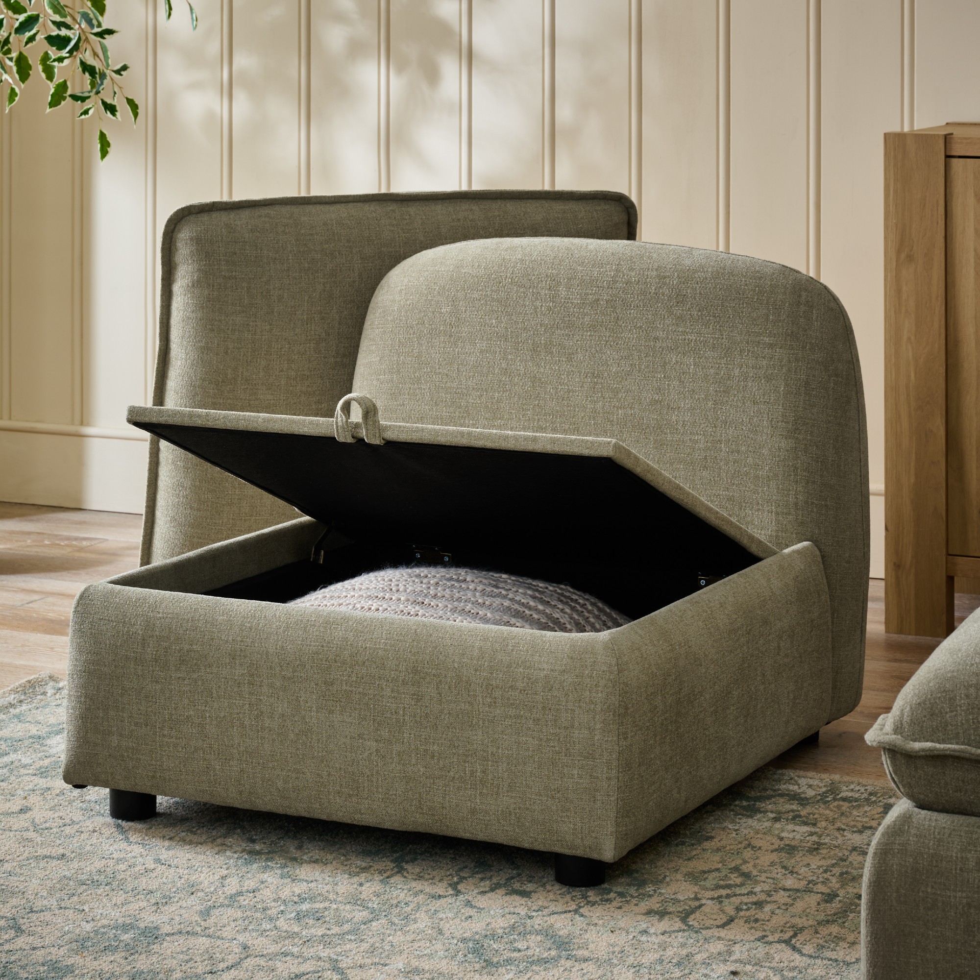 A single module of Next's Crosby modular storage sofa in light olive with open internal storage