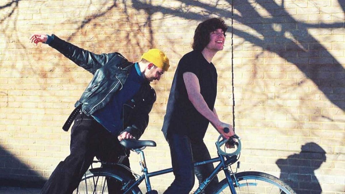 Dylan Gers and Noah Yorke riding a bicycle