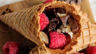 Campfire dessert cone stuffed with fruit and chocolate