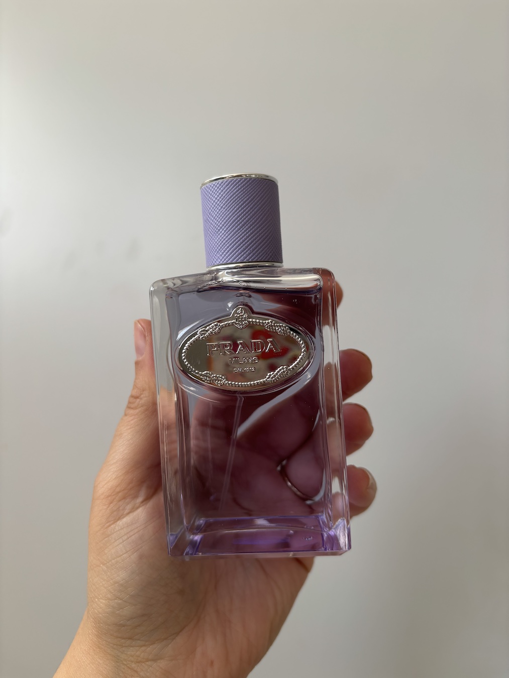 Mica Ricketts holding Prada Infusion de Figue