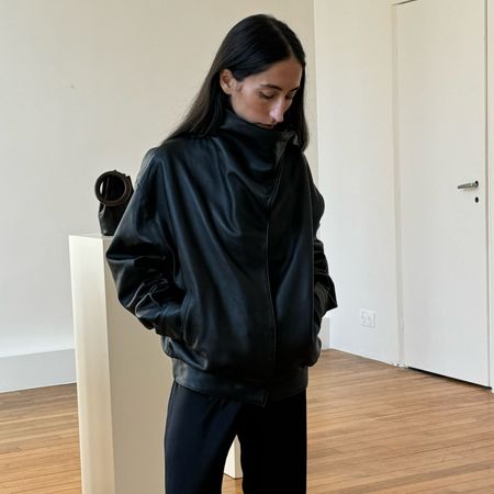 Alexis Badiyi wearing a leather jacket with black pants at Paris Fashion Week