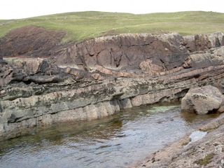 Laminar beds of sandstone have preserved the crater under the Minch Basin.
