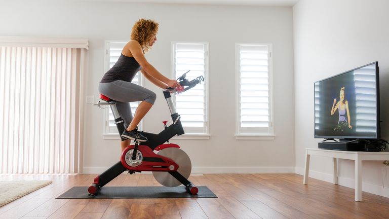 Woman using the best exercise bike