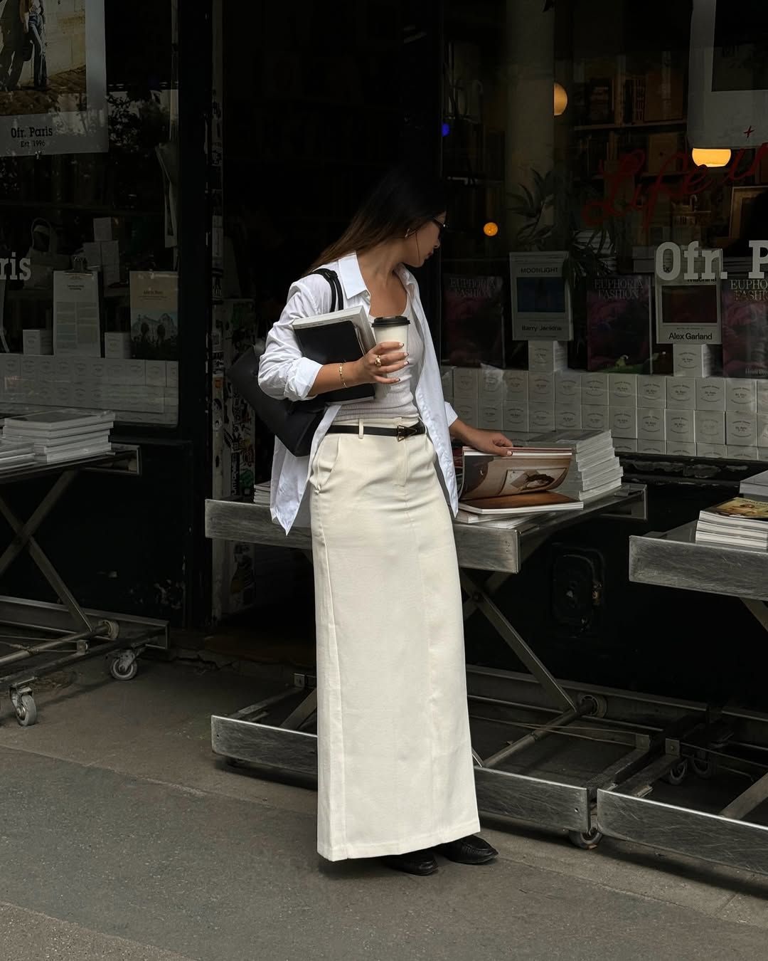 @thecarolinelin wearing a white column skirt, shirt and flats