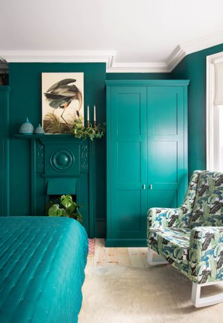 Green bedroom with built in wardrobe