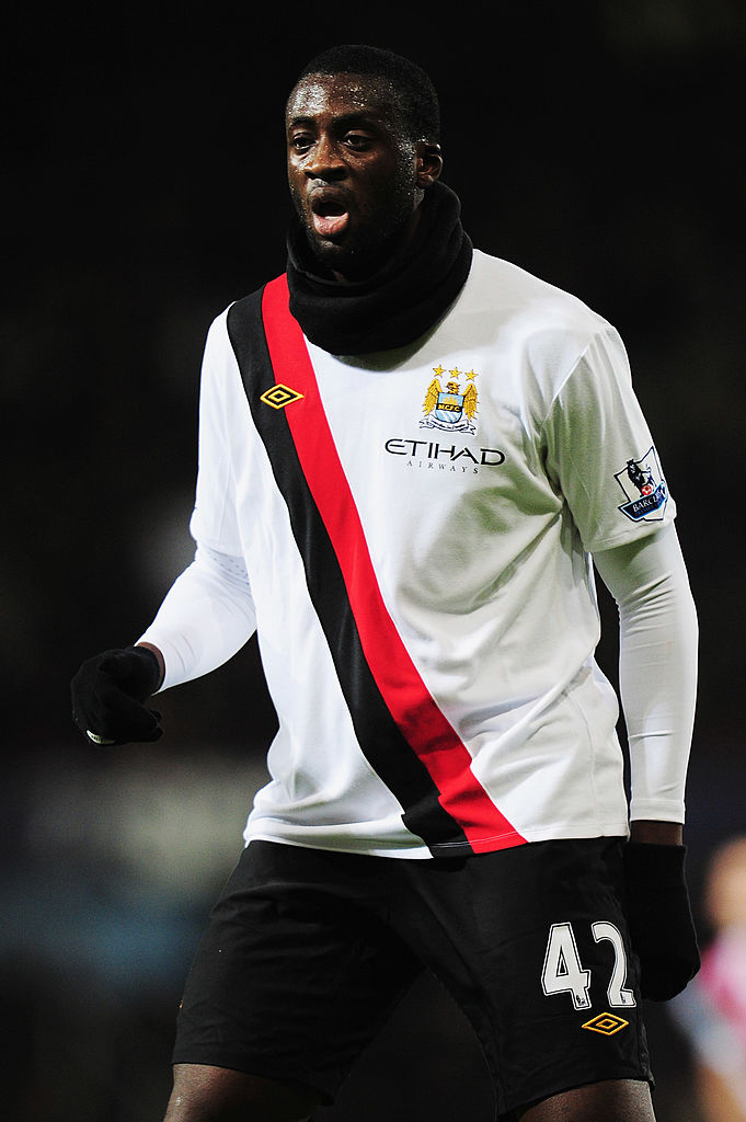 Yaya Toure in action for Manchester City in 2010, wearing a snood
