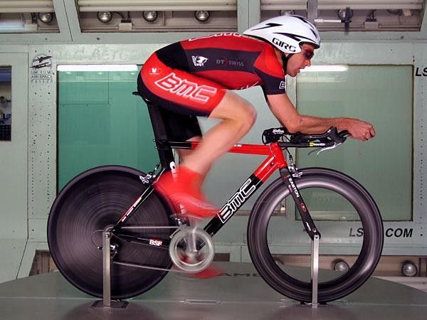 In wind tunnel testing the rider faces a consistent 30mph hour wind and has to hold a specific power level at a specific cadence during each position change. The gain (or loss) in efficiency of the new position is expressed in seconds gained or lost per one-hour of effort.