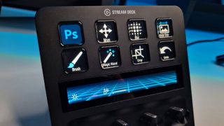 A shot of the Stream Deck + keys with various Photoshop symbols assigned to them
