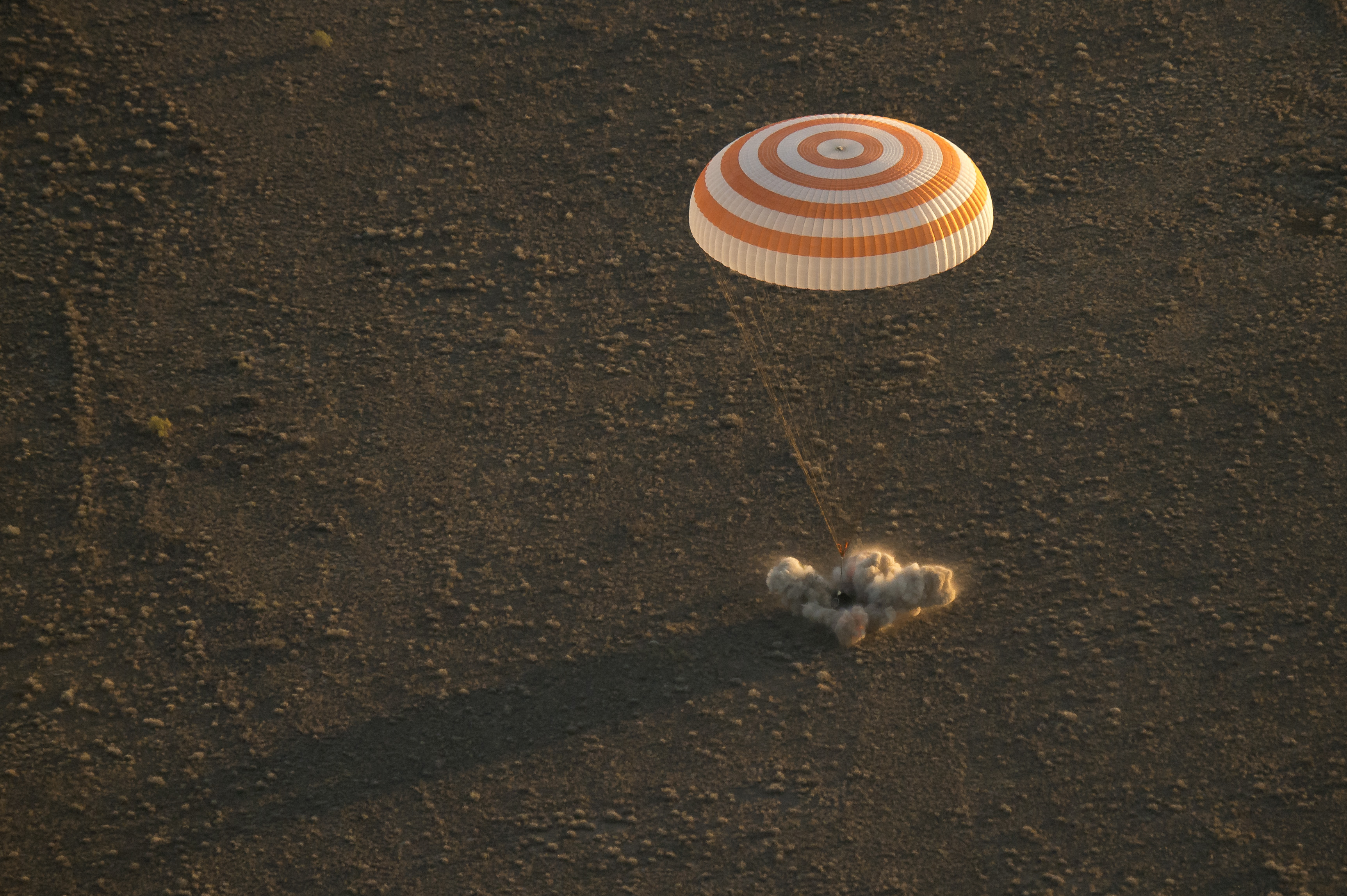 The Soyuz TMA-20M space capsule is seen landing with NASA astronaut Jeff Williams and Russian cosmonauts Oleg Skripochka and Alexey Ovchinin on the steppe of Kazakhstan, Sept. 6, 2016.