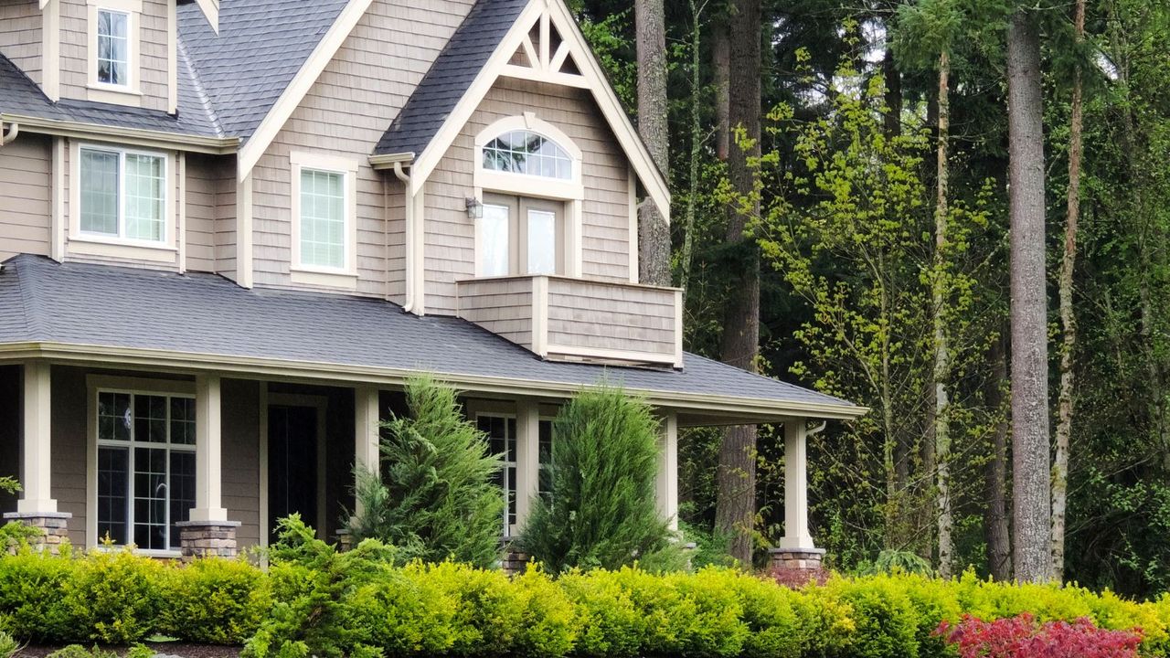 front of a victorian style American home in spring time